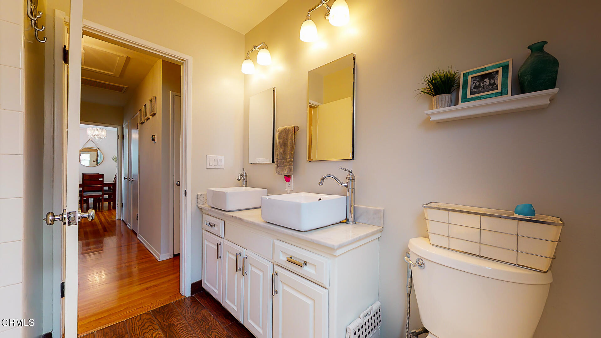 11052 Corley Drive Whittier, CA 90604 - Photo 28 of 39 a bathroom with a sink a toilet and a mirror