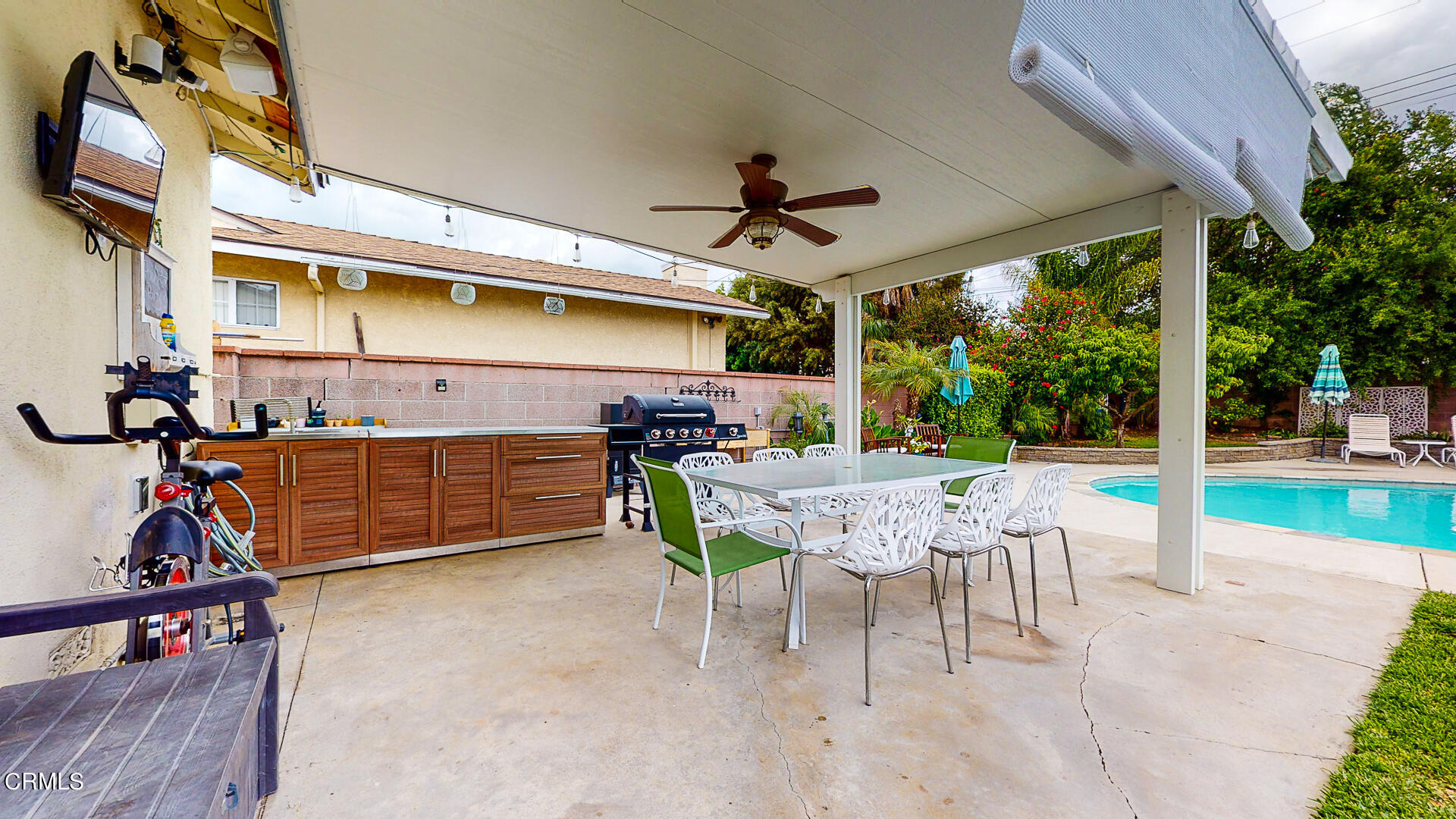 11052 Corley Drive Whittier, CA 90604 - Photo 30 of 39 a view of a patio with a table and chairs under an umbrella