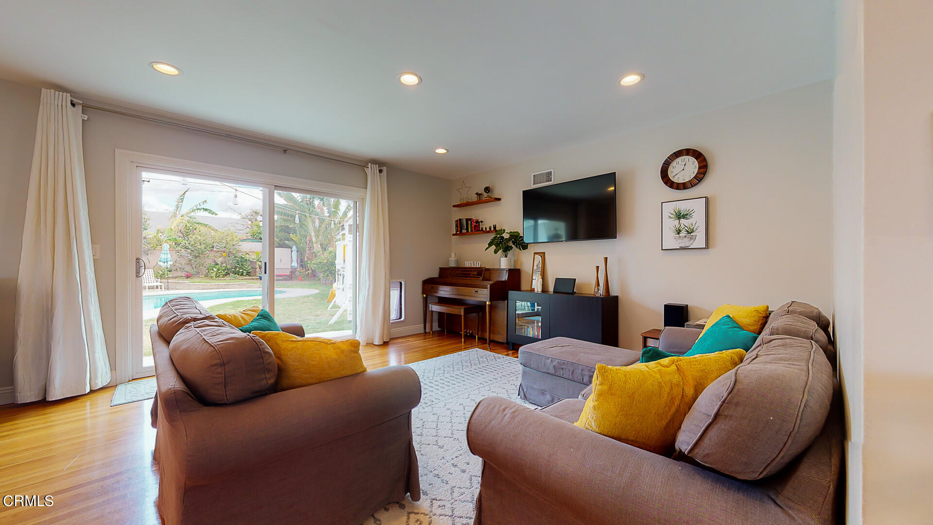 11052 Corley Drive Whittier, CA 90604 - Photo 3 of 39 a living room with furniture and a flat screen tv