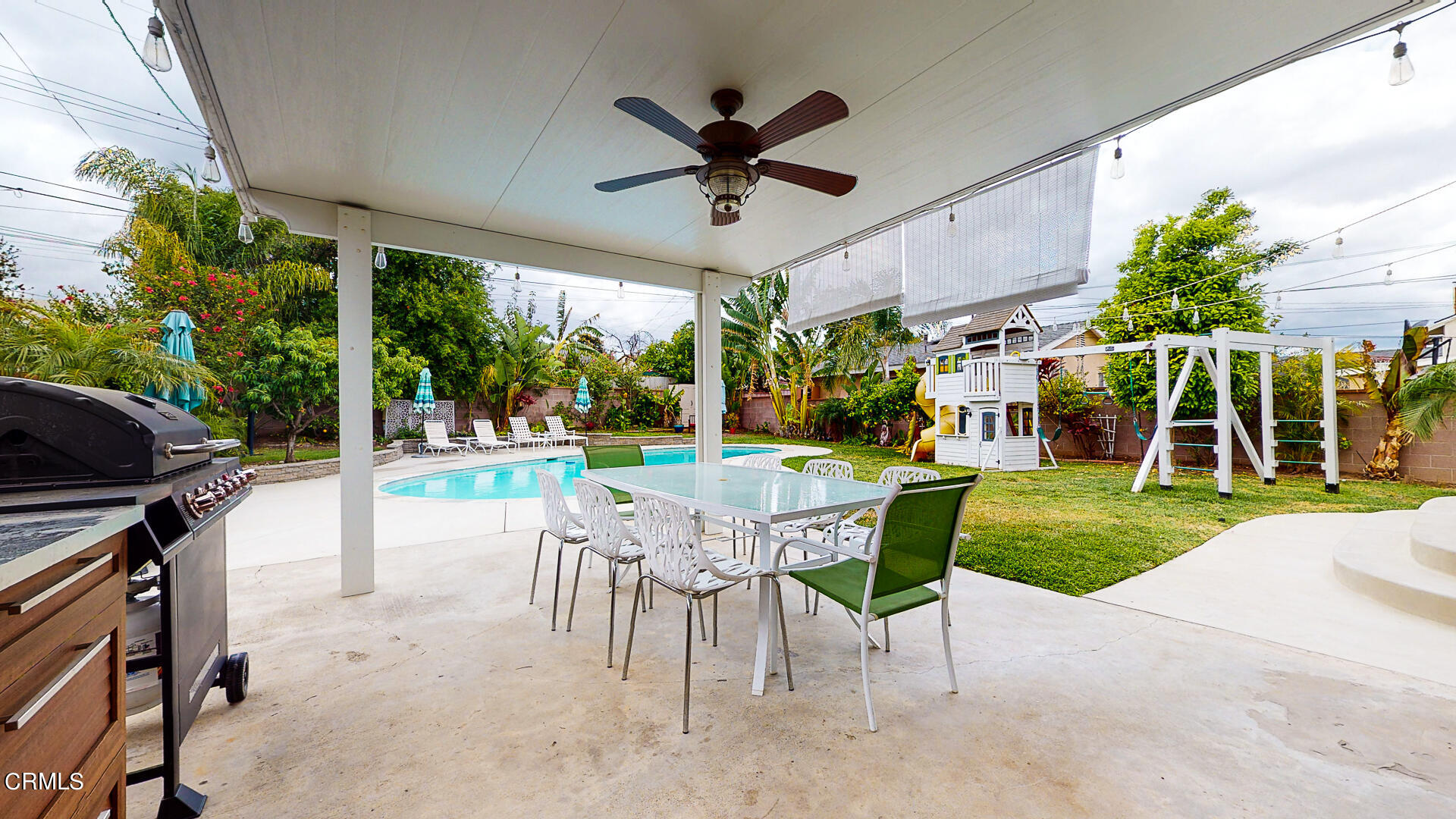 11052 Corley Drive Whittier, CA 90604 - Photo 31 of 39 a view of a patio with a table chairs and a yard