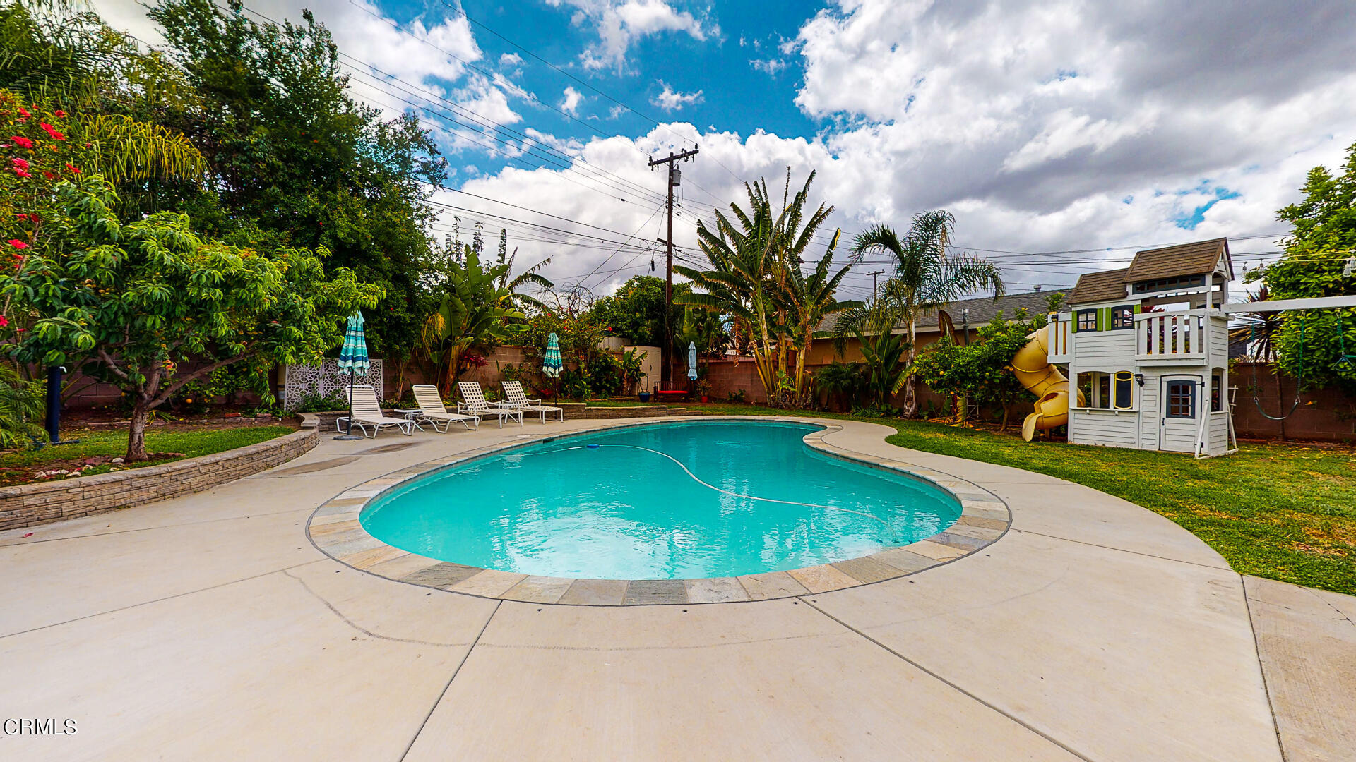 11052 Corley Drive Whittier, CA 90604 - Photo 34 of 39 a view of a swimming pool with a yard