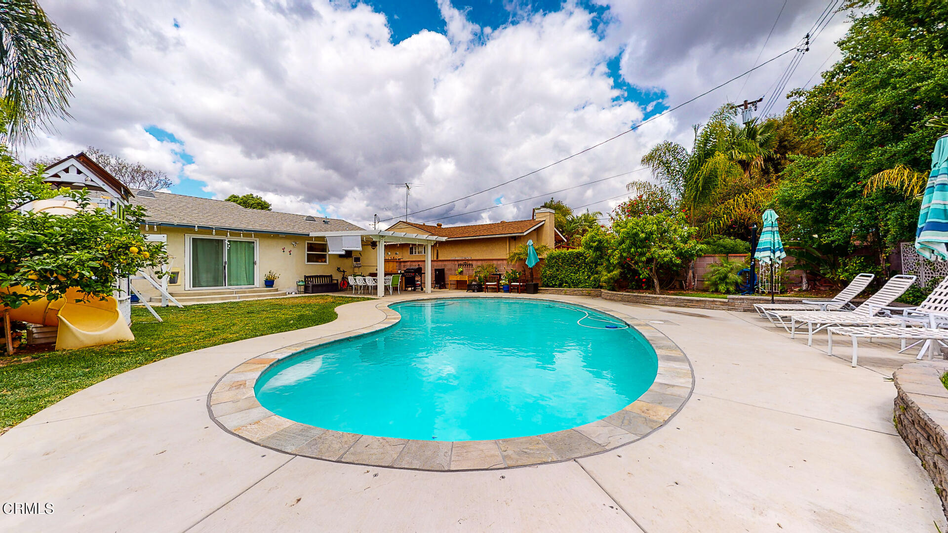 11052 Corley Drive Whittier, CA 90604 - Photo 36 of 39 a view of a swimming pool with a yard in back