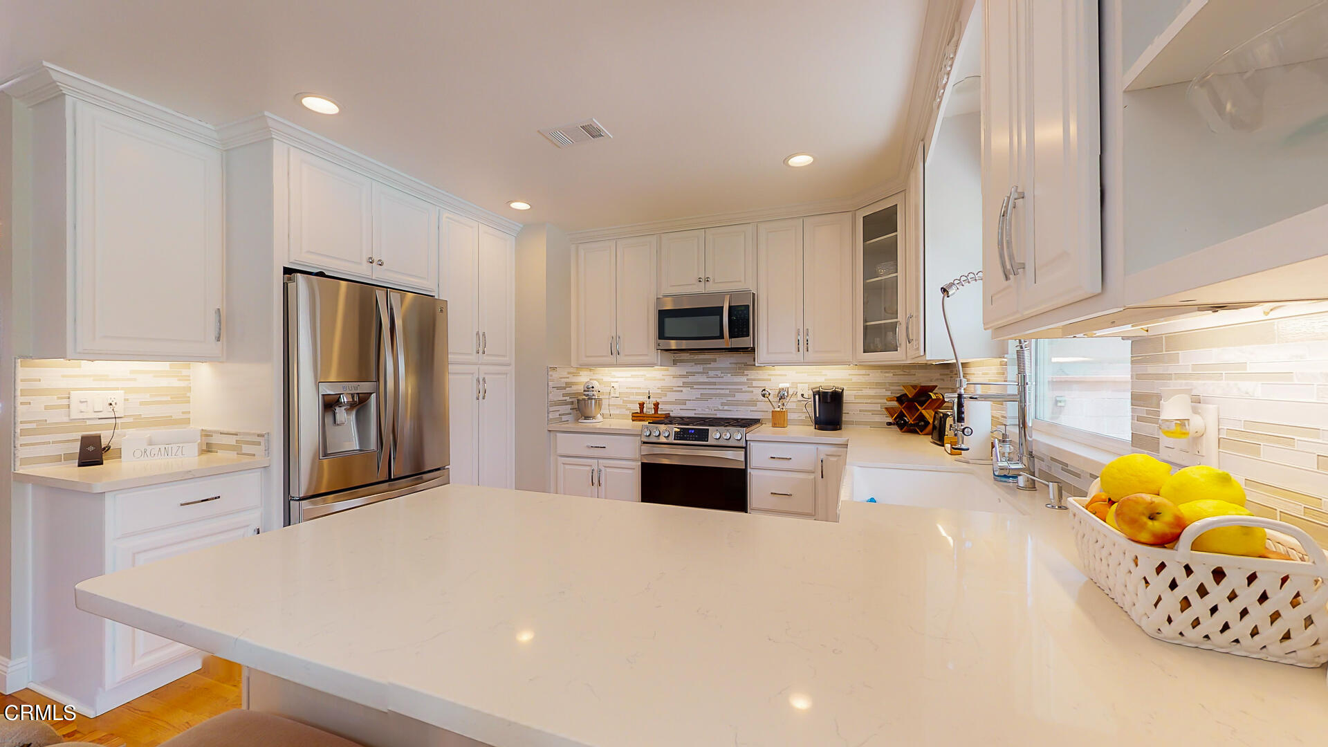 11052 Corley Drive Whittier, CA 90604 - Photo 9 of 39 a kitchen with stainless steel appliances a refrigerator sink and microwave