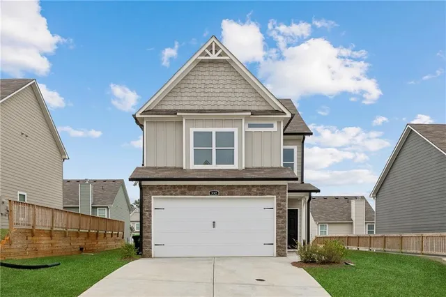 a view of a house with a backyard