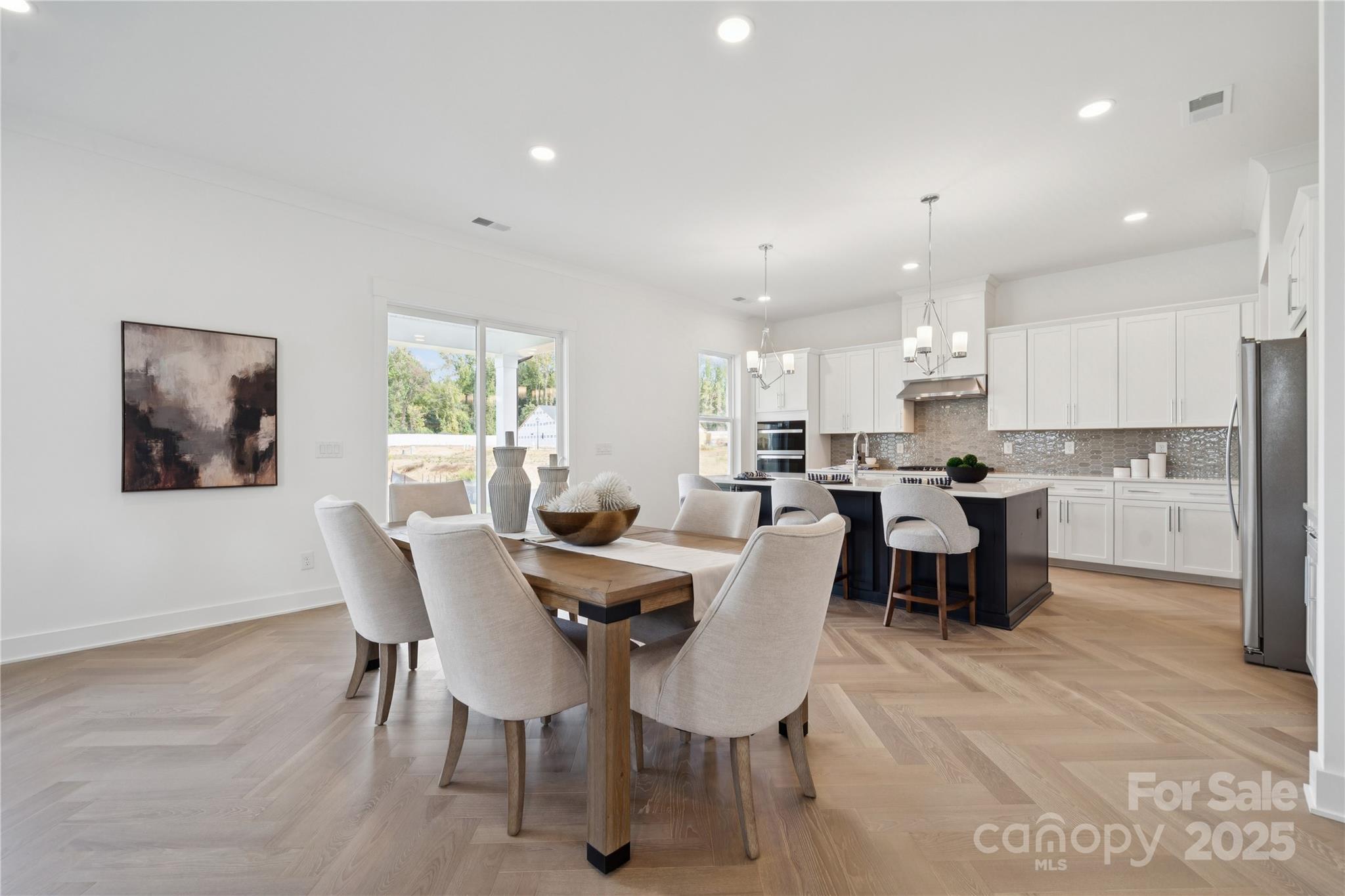 5305 Vernon Rdg Road, Unit 117 Huntersville, NC 28078 - Photo 4 of 11 a view of a dining room with furniture