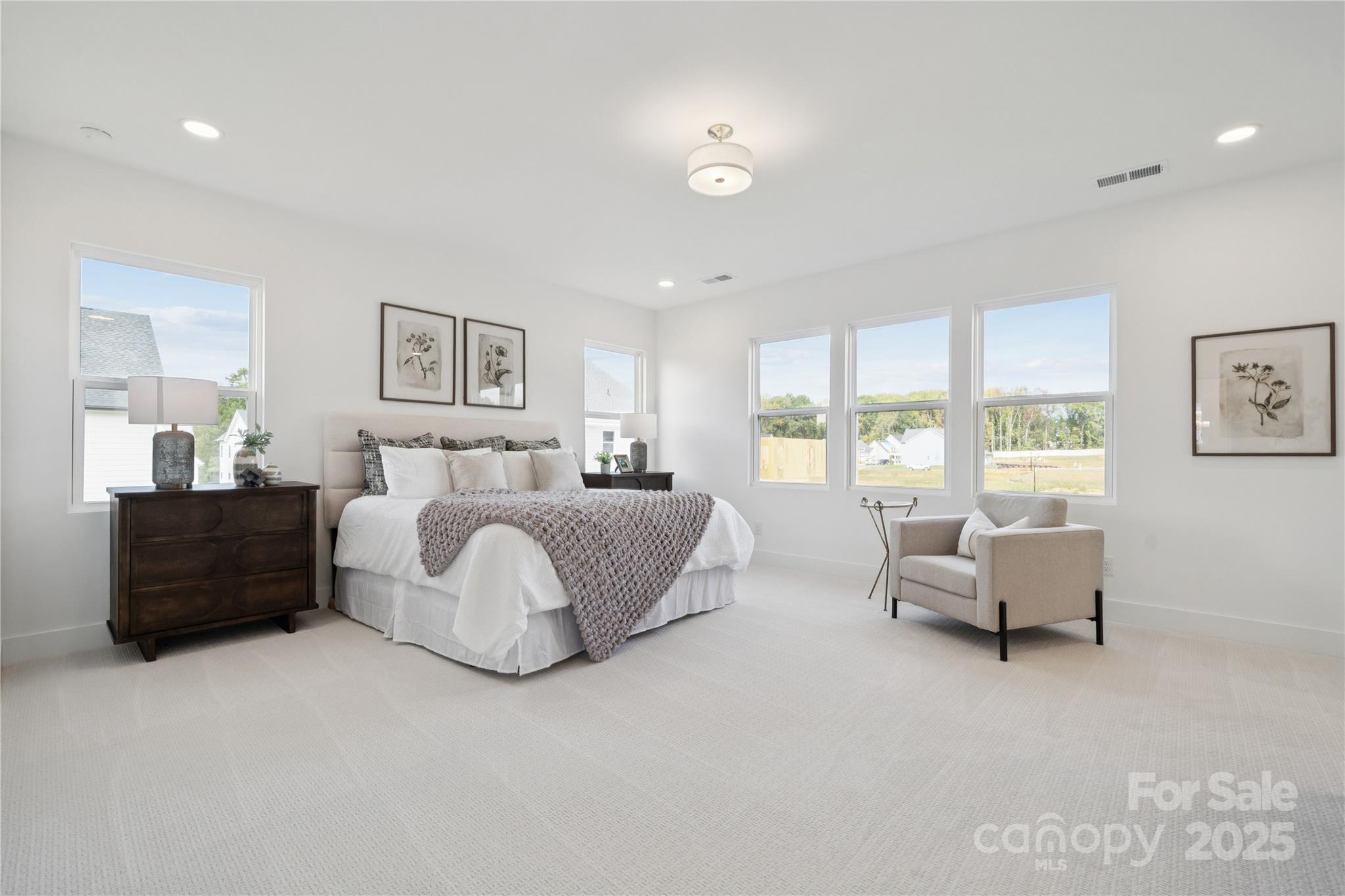 5305 Vernon Rdg Road, Unit 117 Huntersville, NC 28078 - Photo 8 of 11 a spacious bedroom with a bed and glass window
