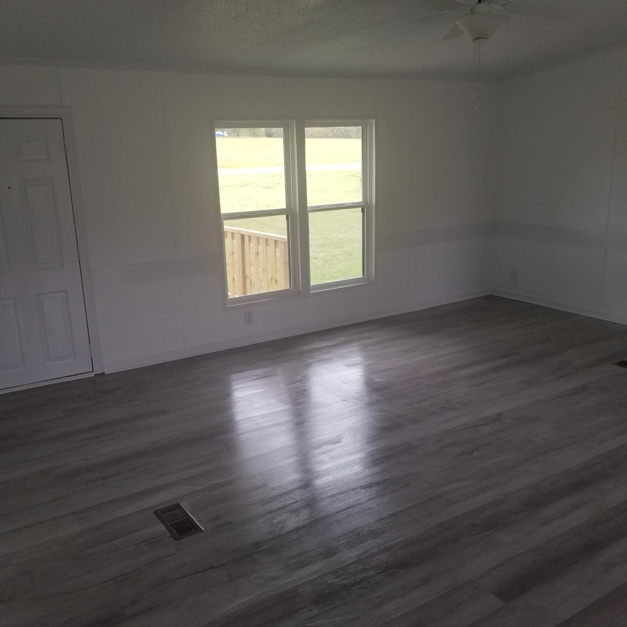 5118 New Harmony Road Hartsville, TN 37074 - Photo 5 of 13 an empty room with wooden floor and windows