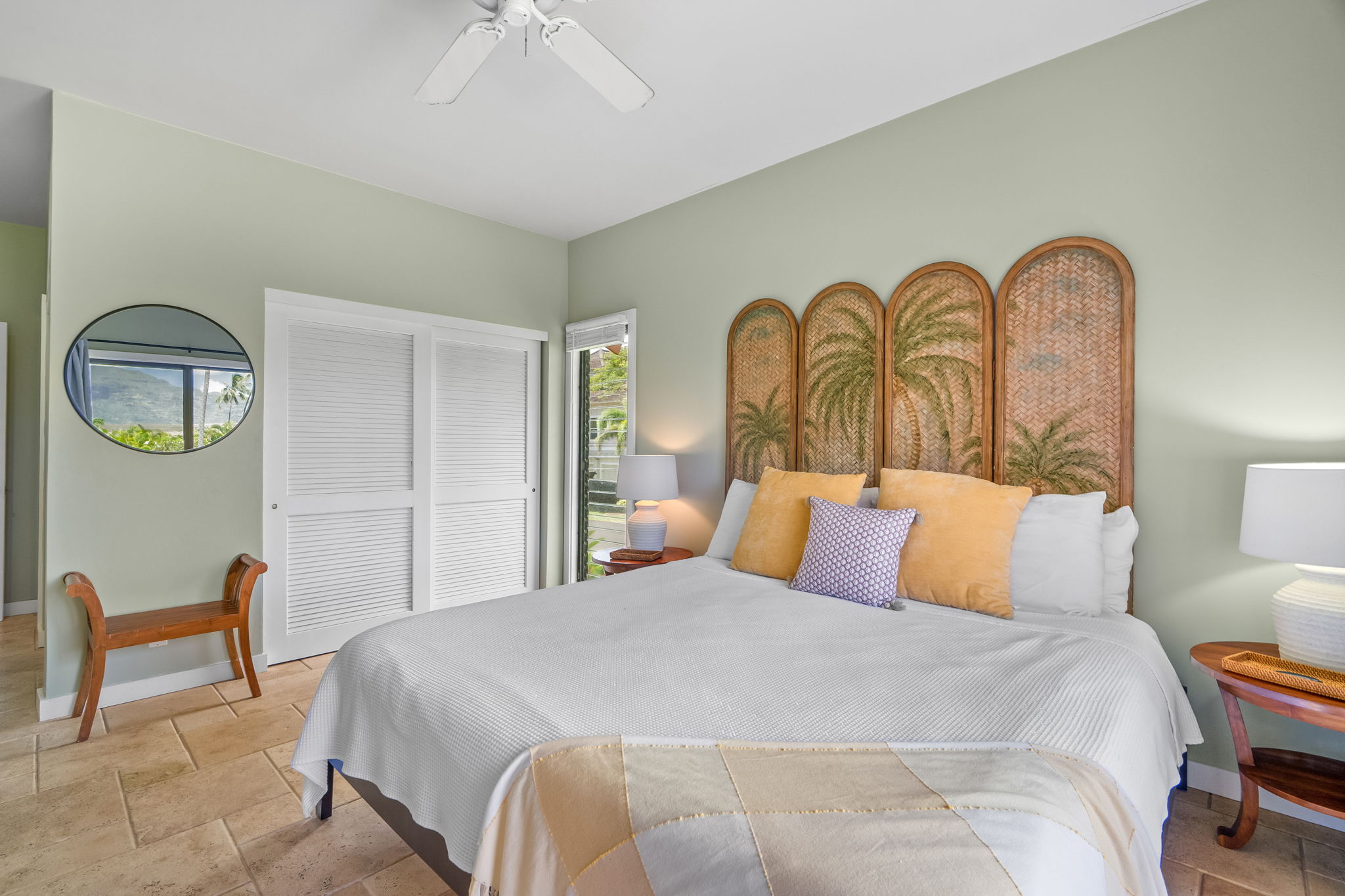 2370 Ho'ohu Road, Unit 712 Koloa, HI 96756 - Photo 18 of 28 a bedroom with a bed and a chandelier