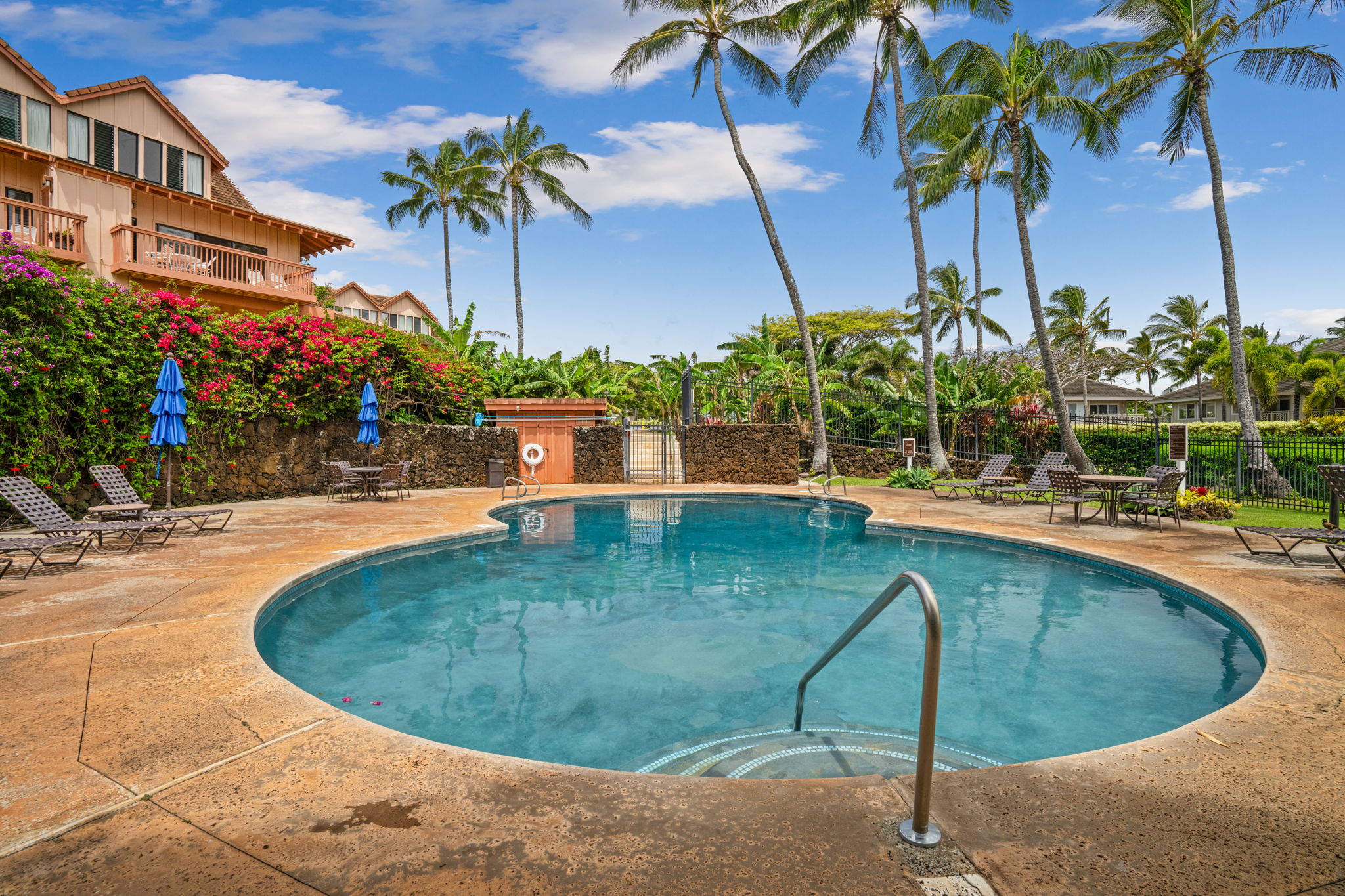 2370 Ho'ohu Road, Unit 712 Koloa, HI 96756 - Photo 26 of 28 a view of a swimming pool with a patio