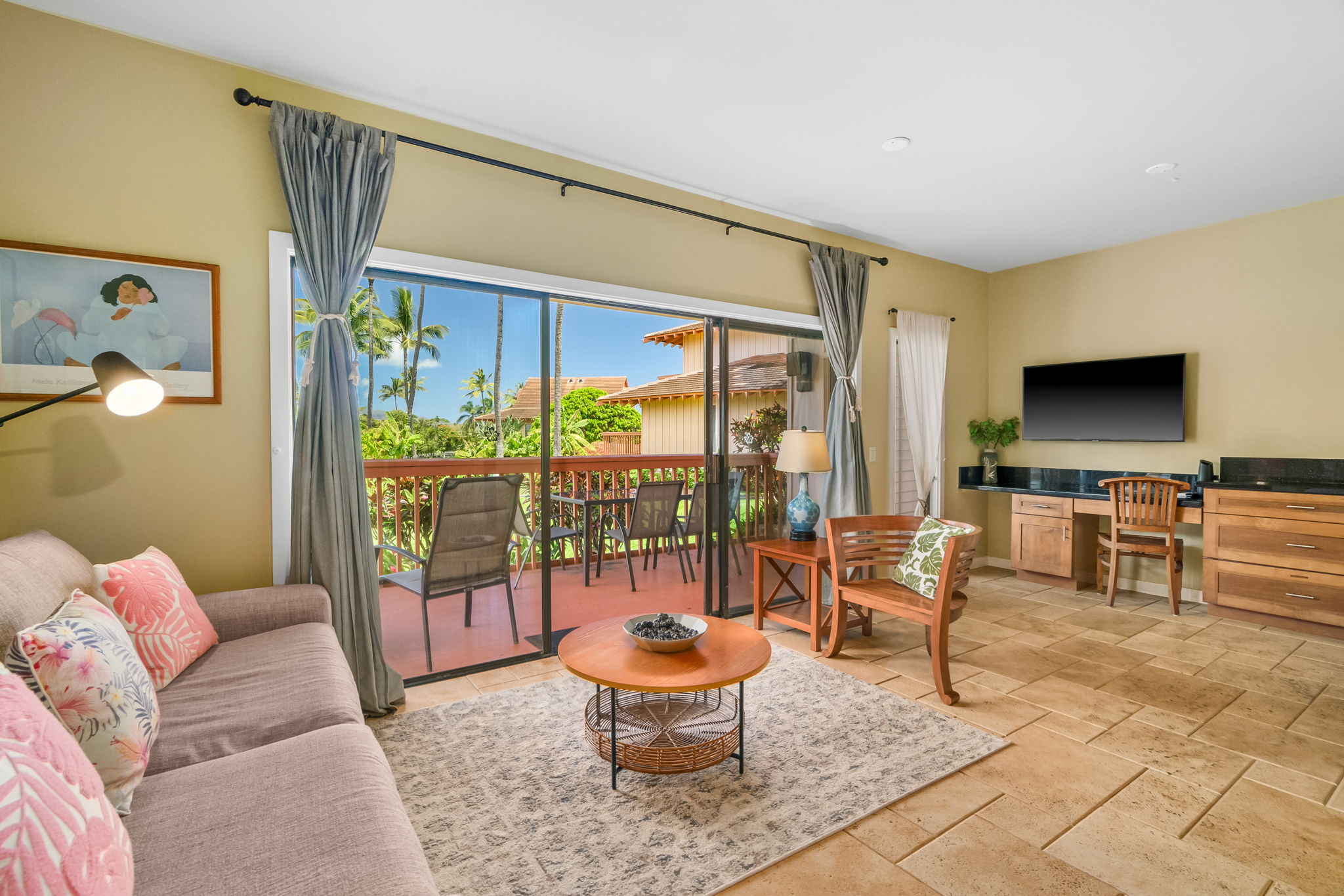 2370 Ho'ohu Road, Unit 712 Koloa, HI 96756 - Photo 4 of 28 a living room with furniture and a flat screen tv