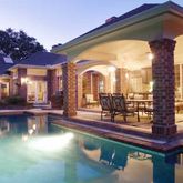 a view of a swimming pool with outdoor seating