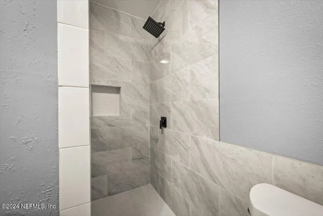 a kitchen with cabinets and stainless steel appliances