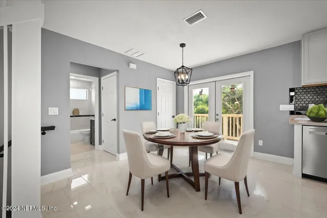 a kitchen with stainless steel appliances granite countertop a kitchen island a stove and a sink