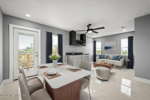 a front view of a house with a yard table and chairs