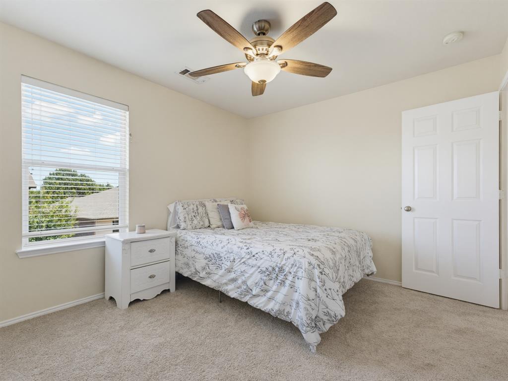 13268 Fencerow Road Fort Worth, TX 76244 - Photo 18 of 25 Neutral wall tones featuring light-colored carpeting