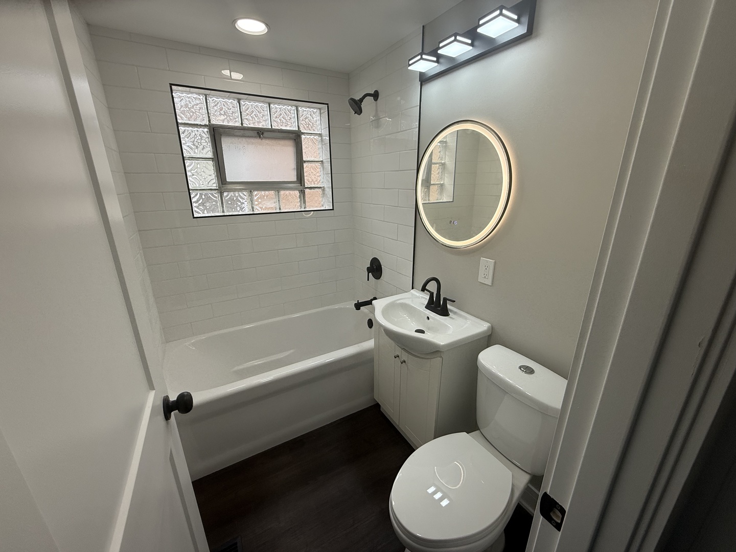 10531 South Morgan Street Chicago, IL 60643 - Photo 7 of 50 a white toilet sitting next to a bathroom sink and a tub