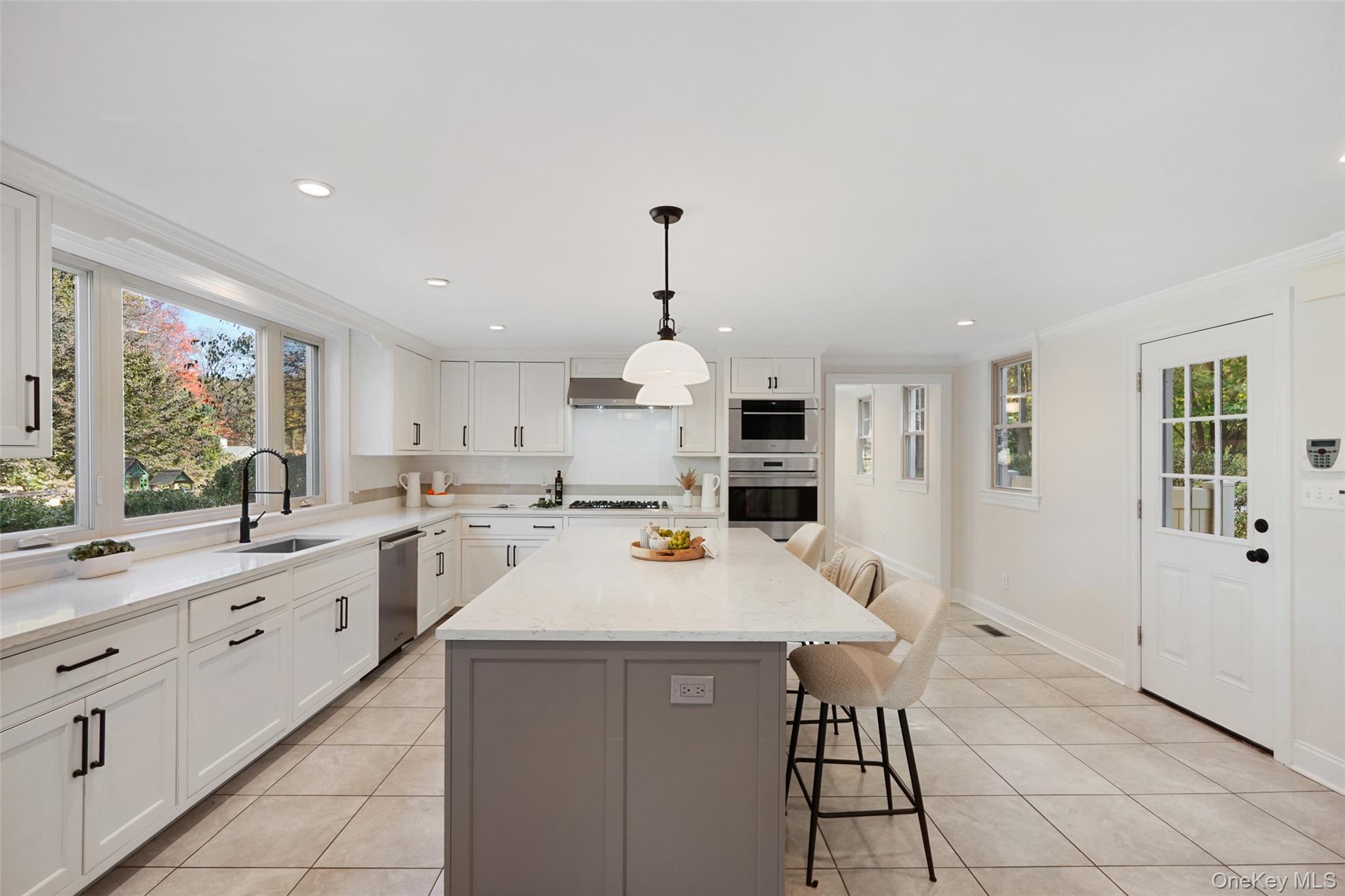 9 Oregon Road Bedford Corners, NY 10549 - Photo 11 of 35 a kitchen with stainless steel appliances a sink stove and cabinets