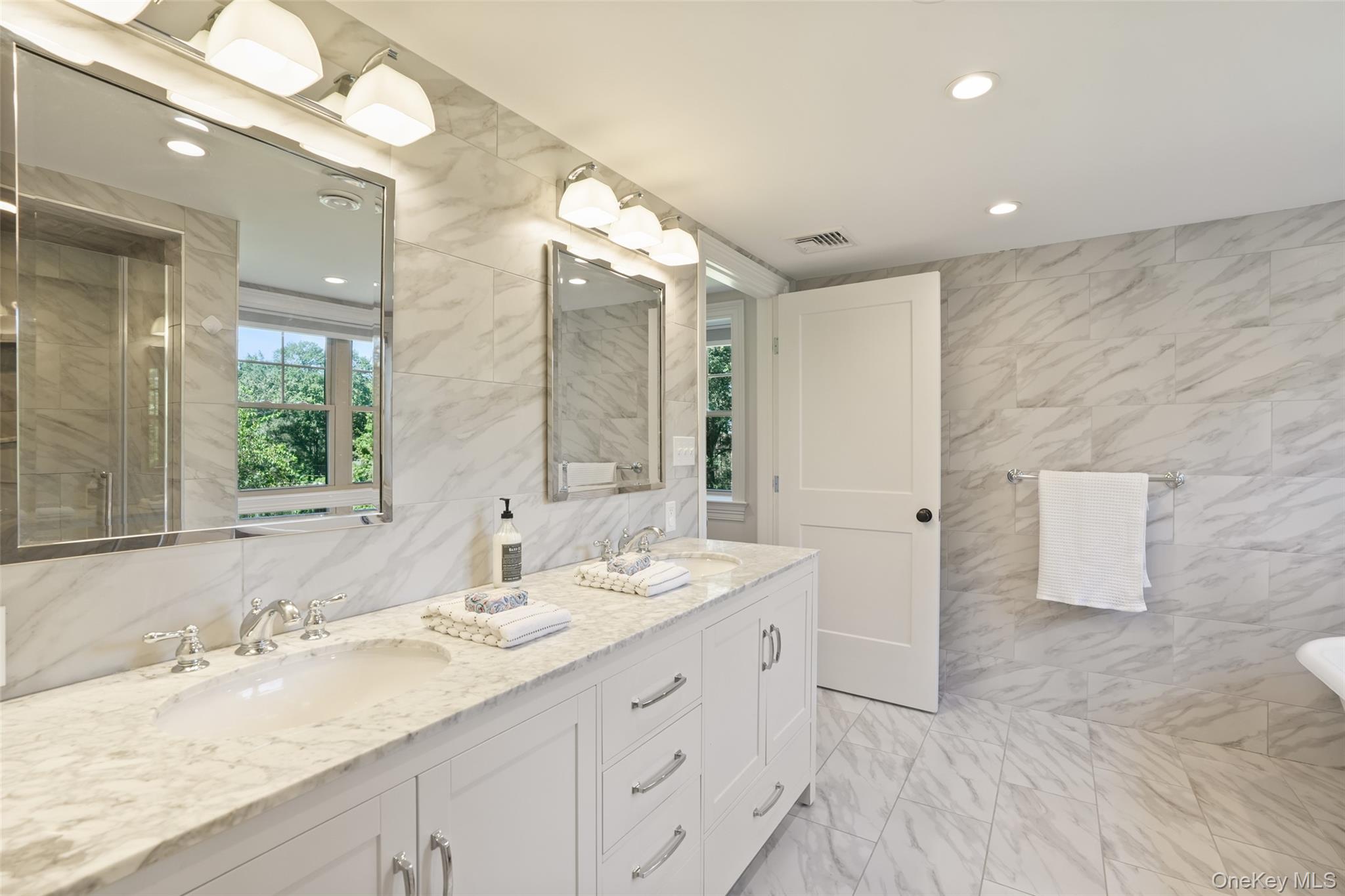 9 Oregon Road Bedford Corners, NY 10549 - Photo 16 of 35 a bathroom with a sink double vanity and a mirror