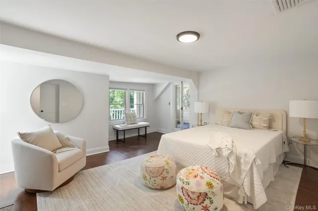 a bedroom with a bed and a couch