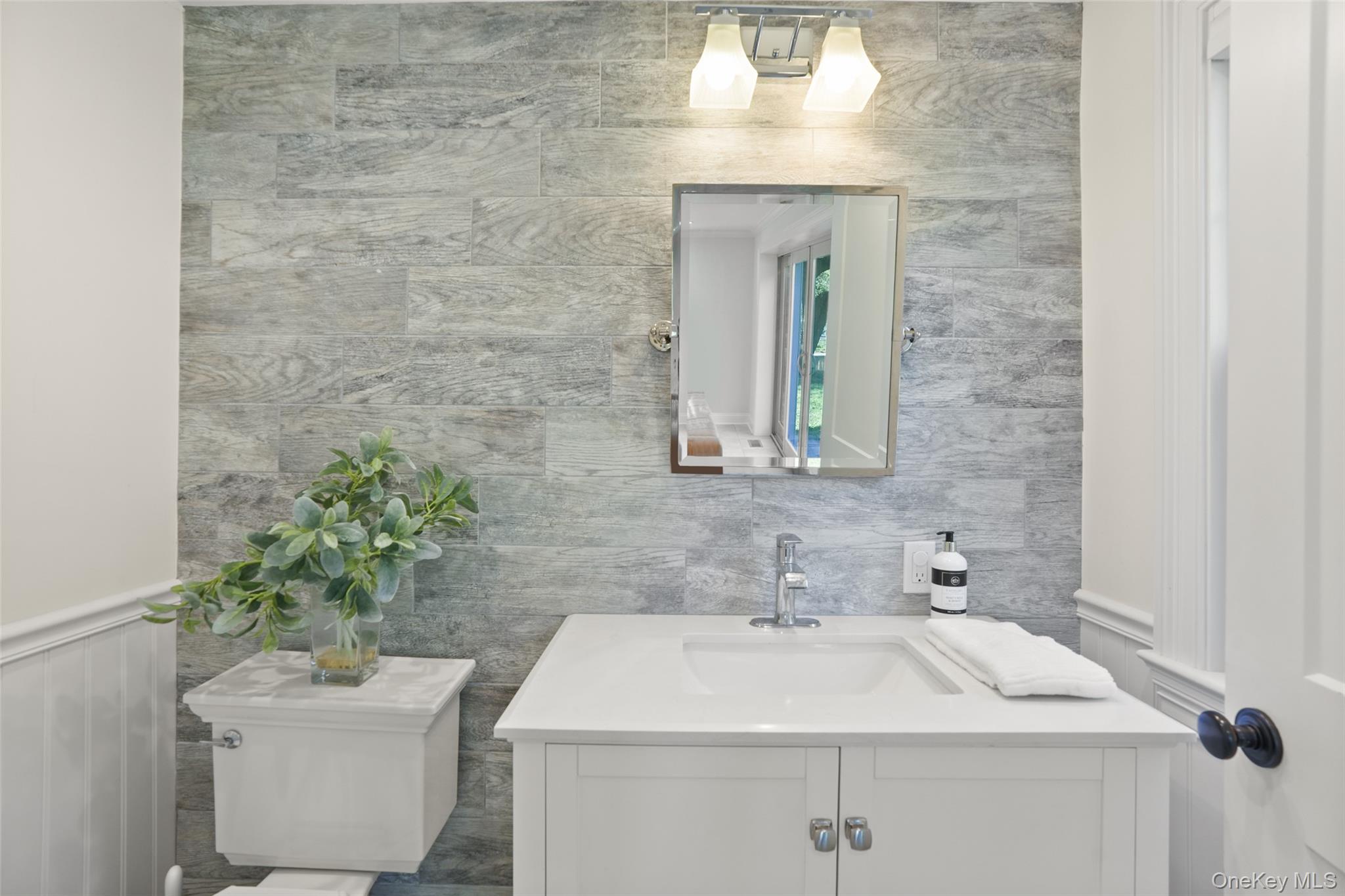9 Oregon Road Bedford Corners, NY 10549 - Photo 25 of 35 a bathroom with a sink and a mirror