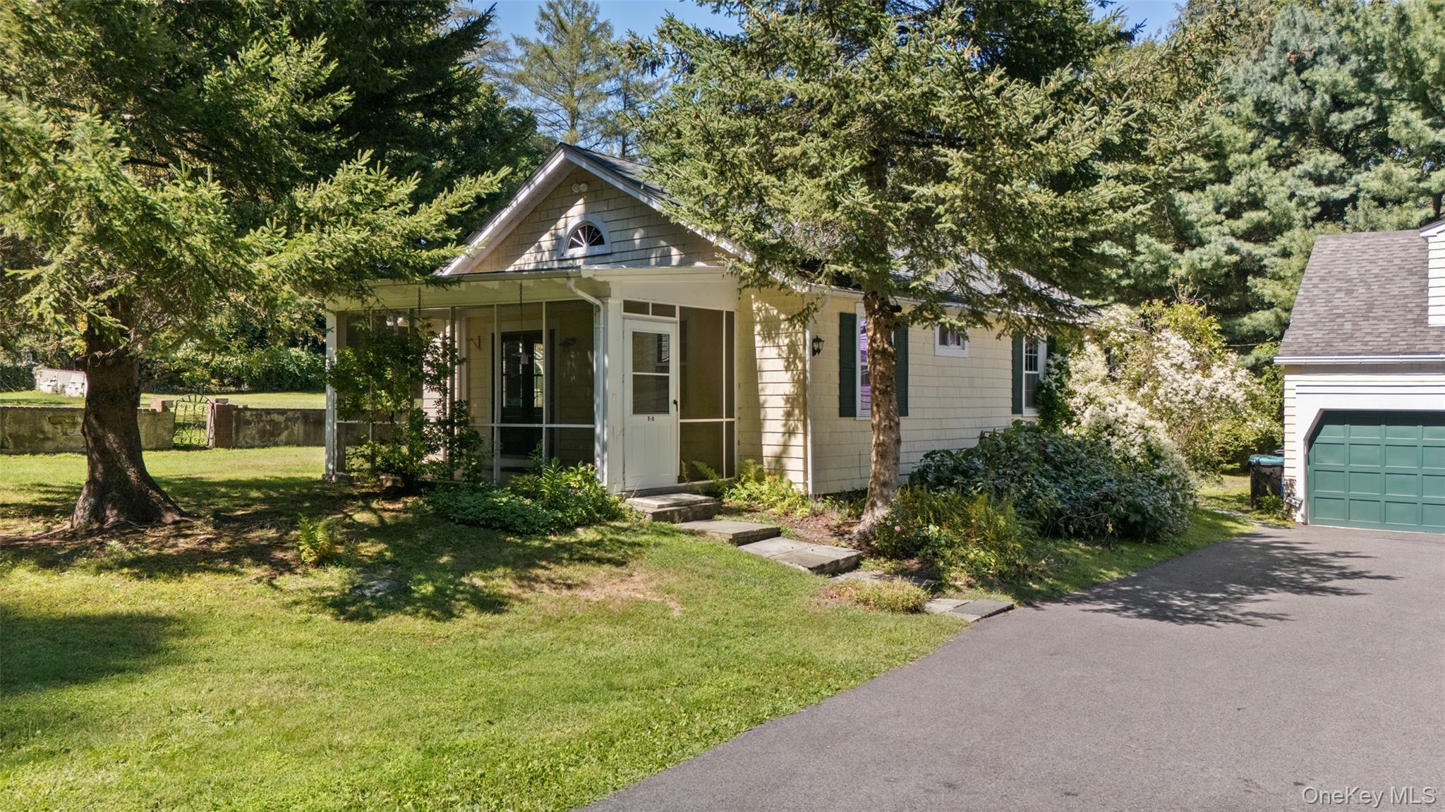 9 Oregon Road Bedford Corners, NY 10549 - Photo 30 of 35 a front view of a house with garden
