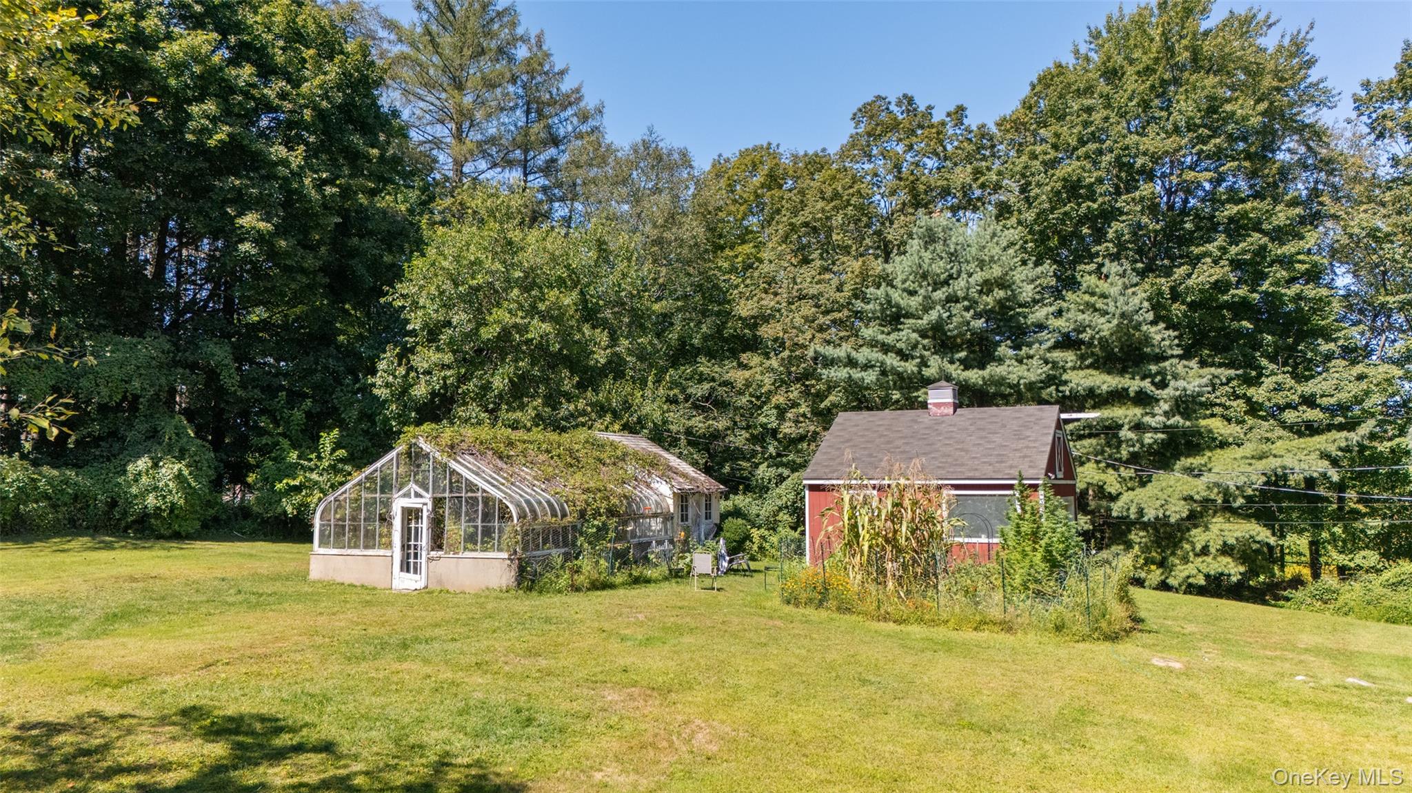 9 Oregon Road Bedford Corners, NY 10549 - Photo 31 of 35 a view of a big house with a yard and large trees