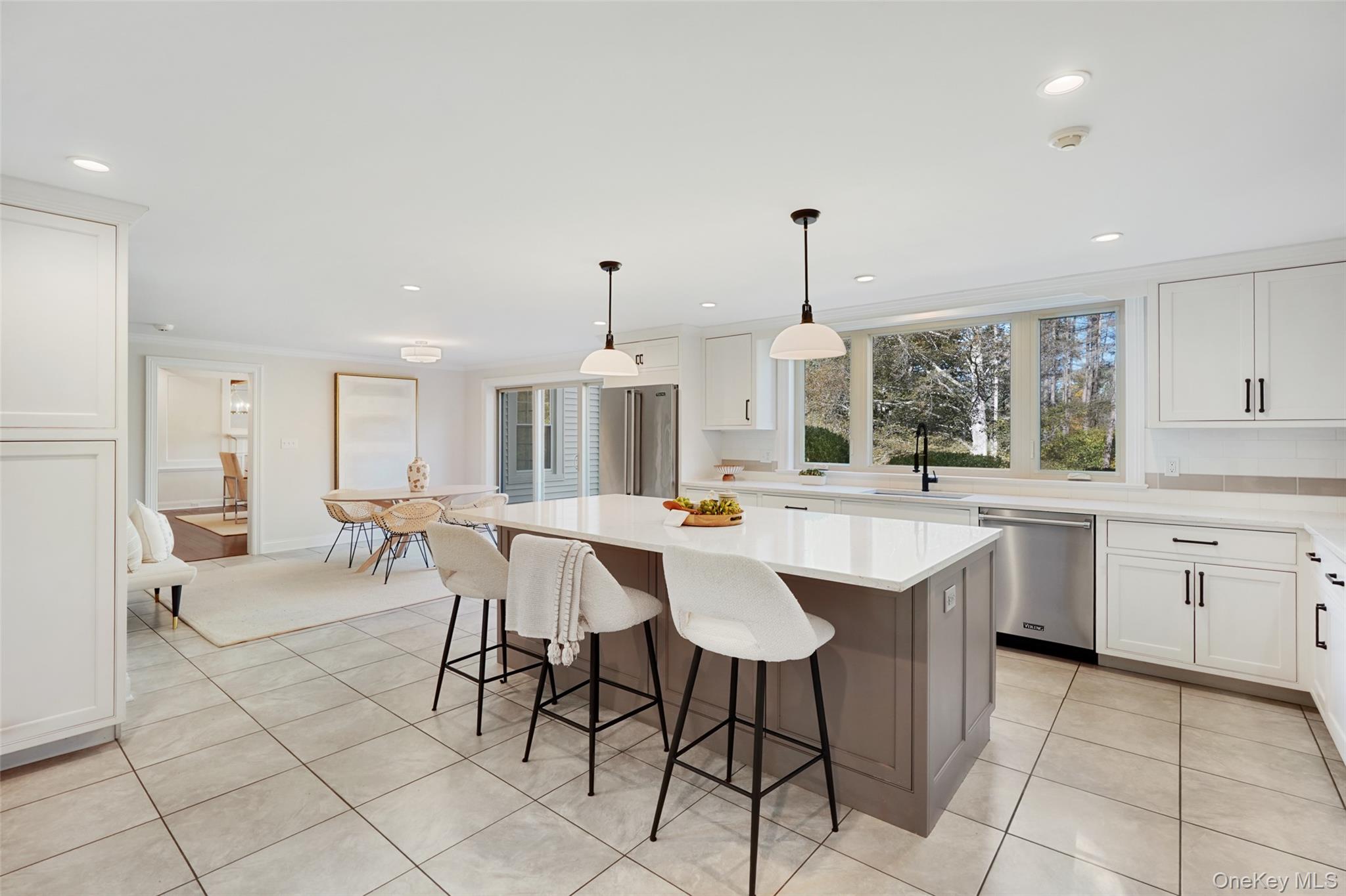 9 Oregon Road Bedford Corners, NY 10549 - Photo 10 of 35 a kitchen with a dining table chairs sink and cabinets
