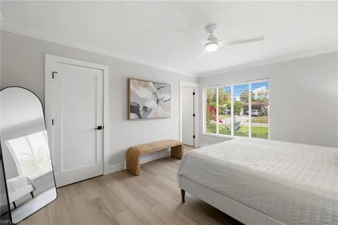 a bedroom with bed and window