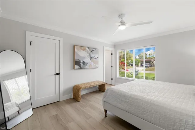 a bedroom with bed and window