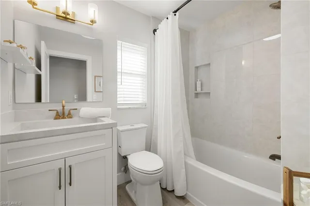 a bathroom with a sink a toilet and a bathtub