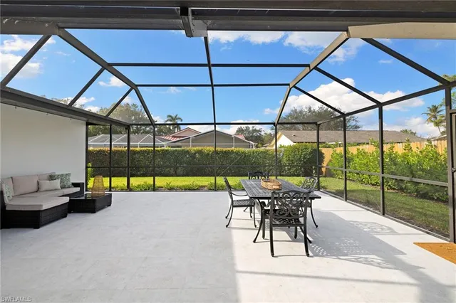 a building outdoor space with seating area and furniture