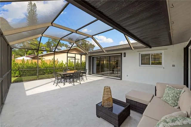 a view of a two chairs in the patio