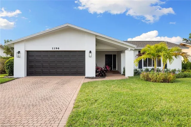 a aerial view of a house with a yard