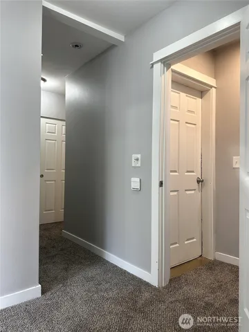 an empty room with closet area