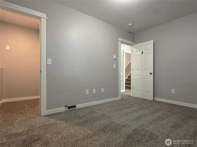 an empty room that has a window in it