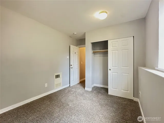 a kitchen with white cabinets