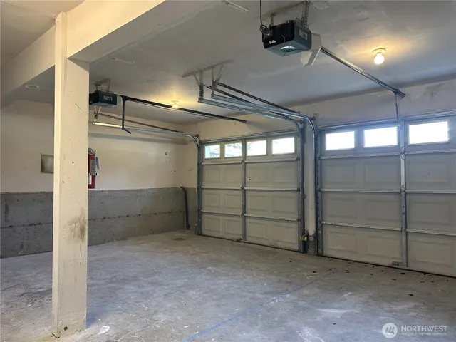 a view of house with a backyard