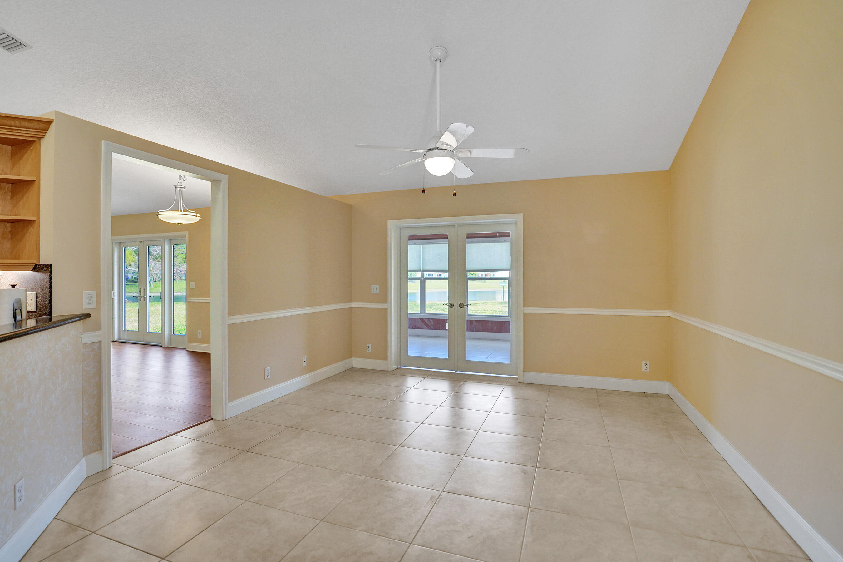 3825 Sabal Lakes Road Delray Beach, FL 33445 - Photo 12 of 33 wooden floor in an empty room with a window