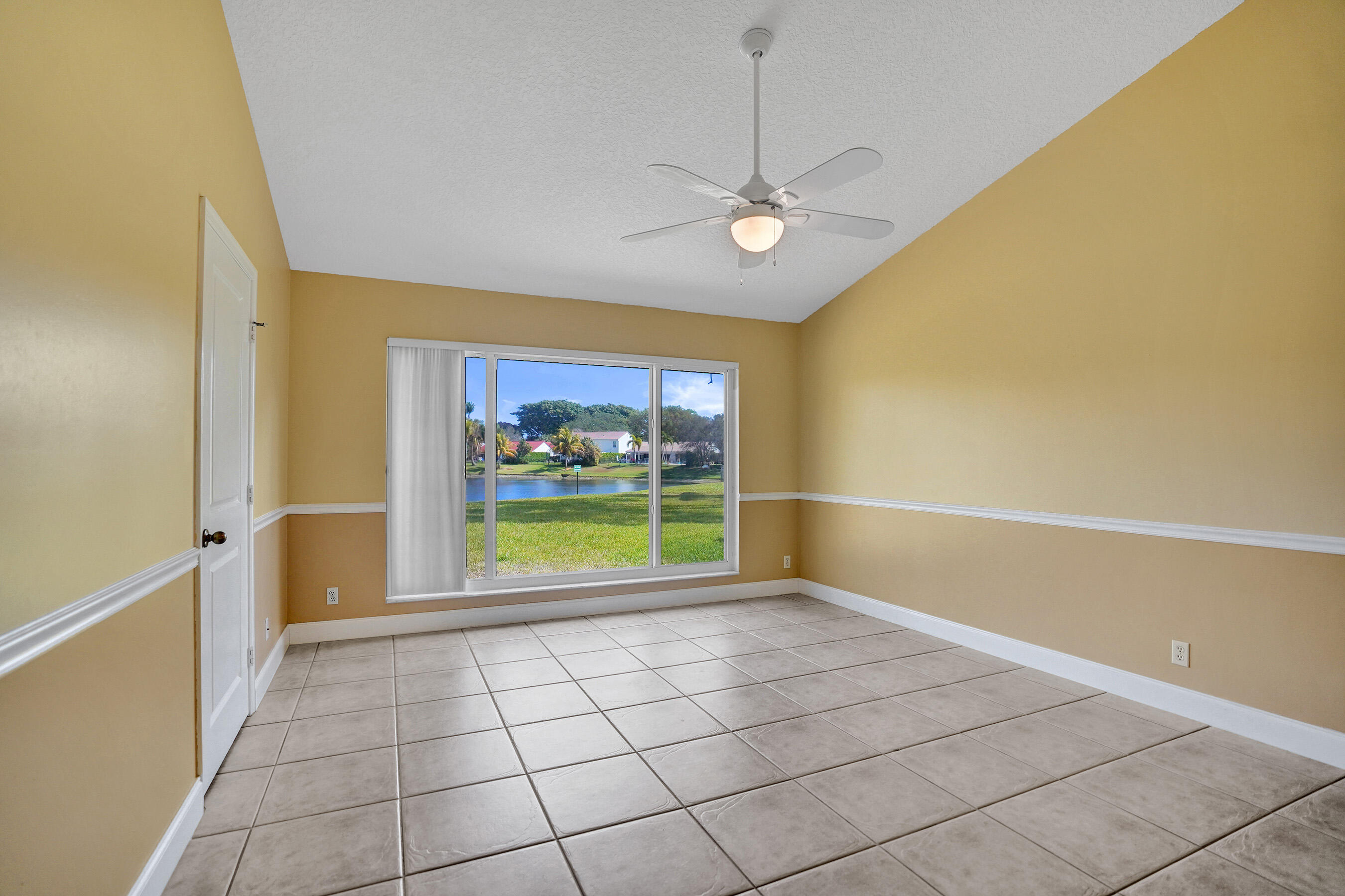 3825 Sabal Lakes Road Delray Beach, FL 33445 - Photo 15 of 33 a view of an empty room with a window