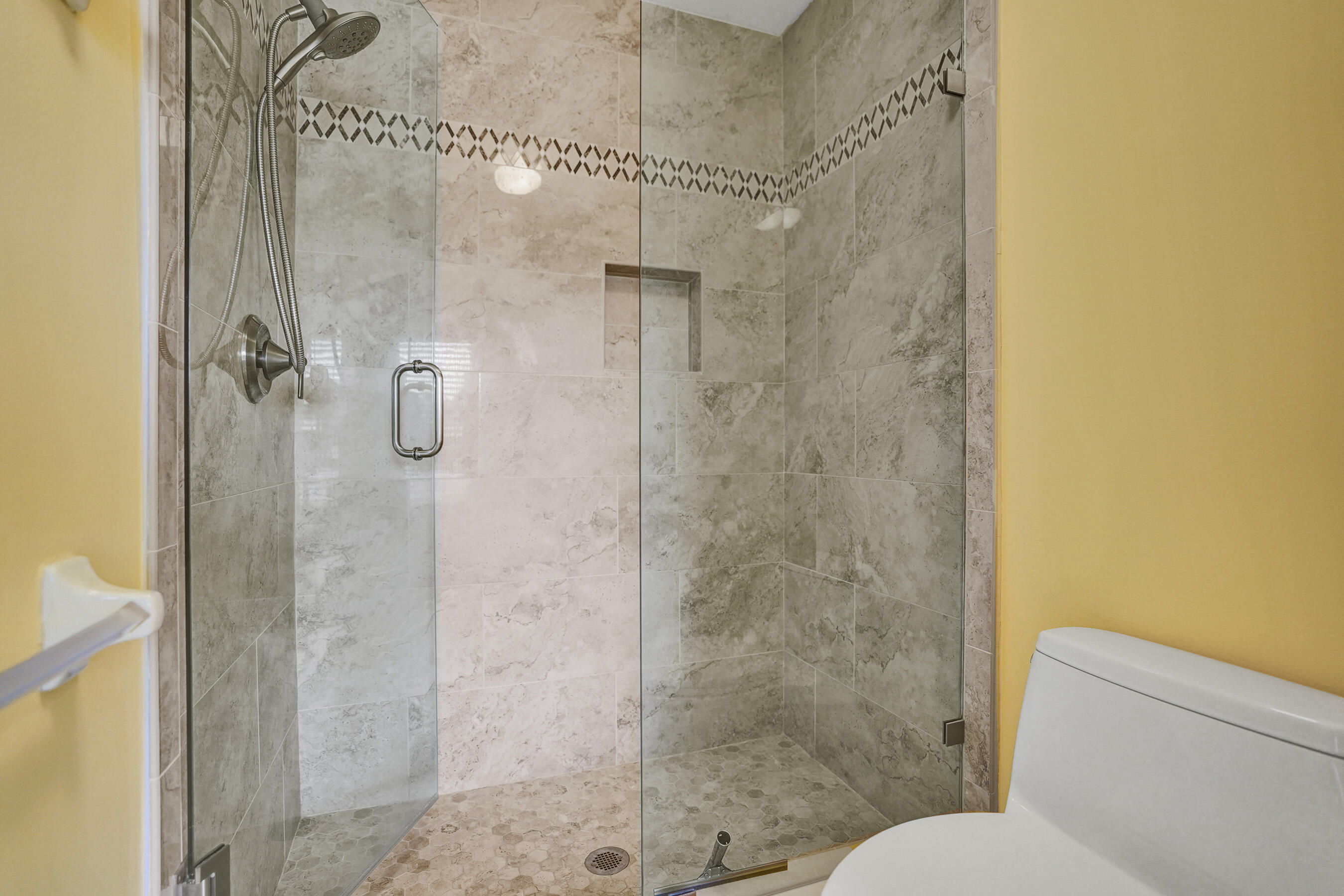 3825 Sabal Lakes Road Delray Beach, FL 33445 - Photo 18 of 33 a bathroom with a shower and toilet