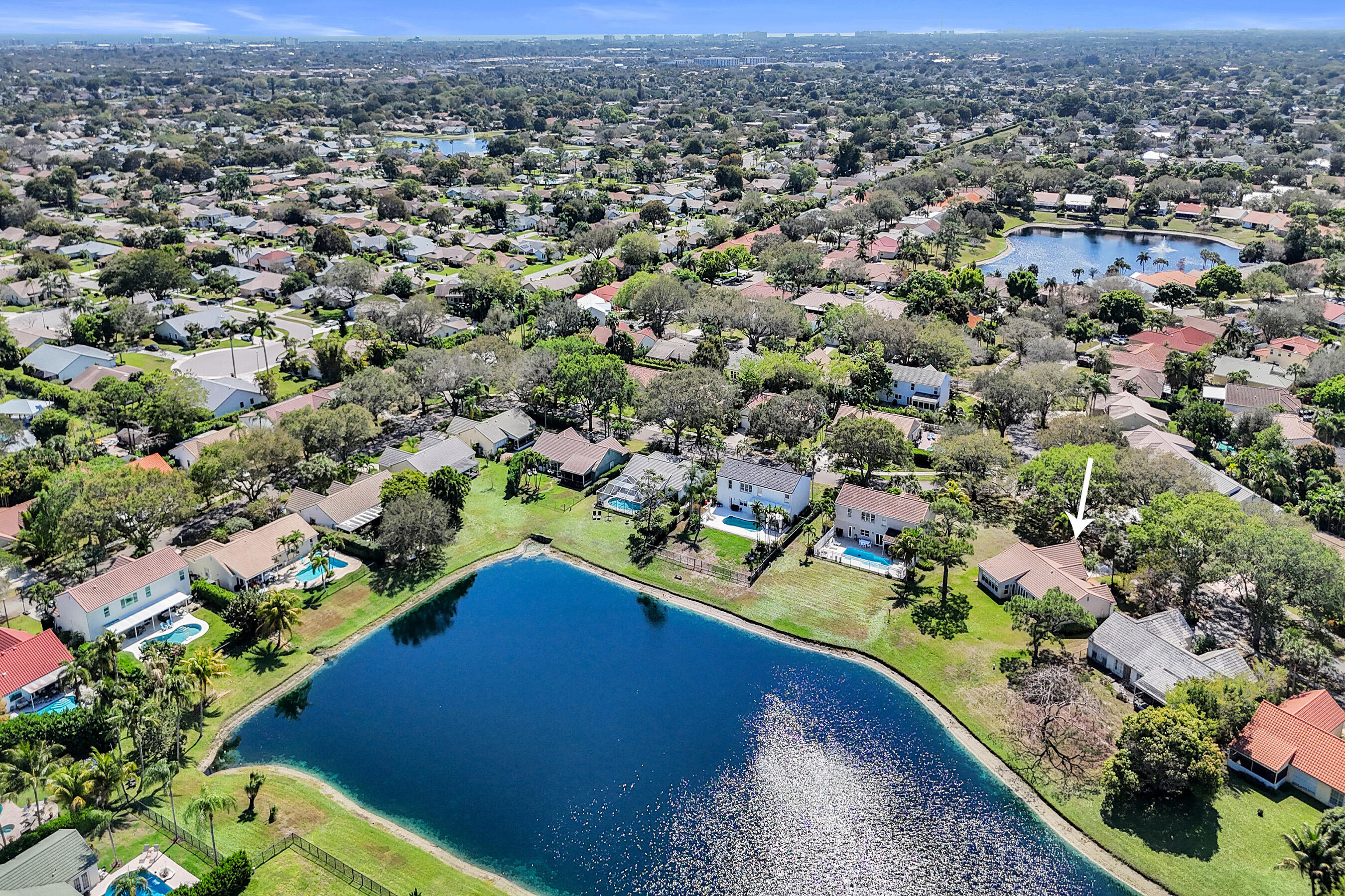 3825 Sabal Lakes Road Delray Beach, FL 33445 - Photo 2 of 33 an aerial view of residential houses with outdoor space