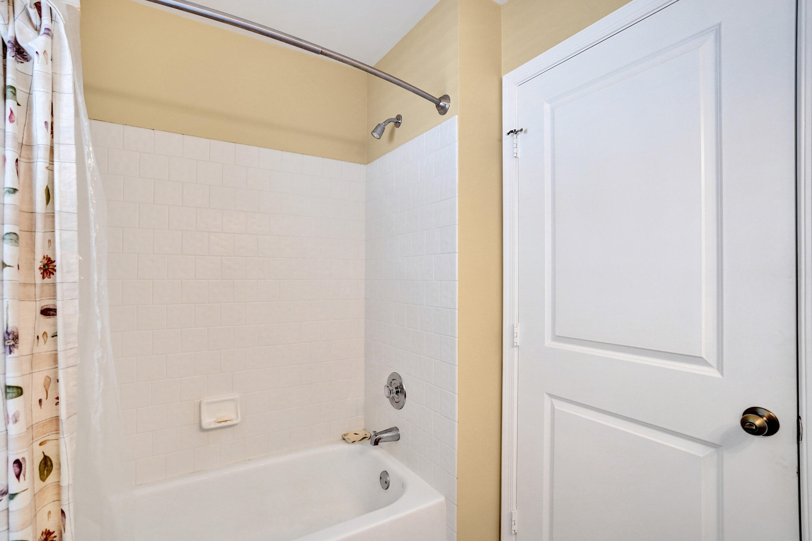 3825 Sabal Lakes Road Delray Beach, FL 33445 - Photo 23 of 33 a bathroom with a bathtub and a shower
