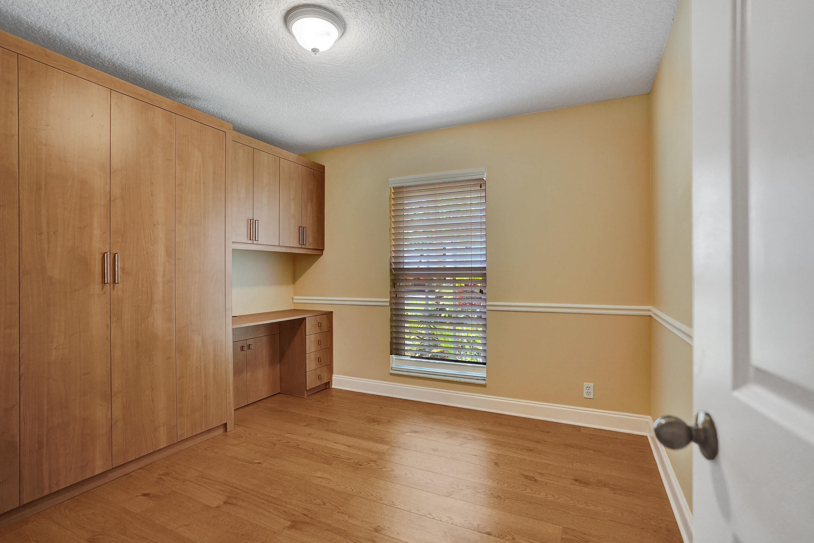 3825 Sabal Lakes Road Delray Beach, FL 33445 - Photo 24 of 33 a view of an empty room with a kitchen and a window