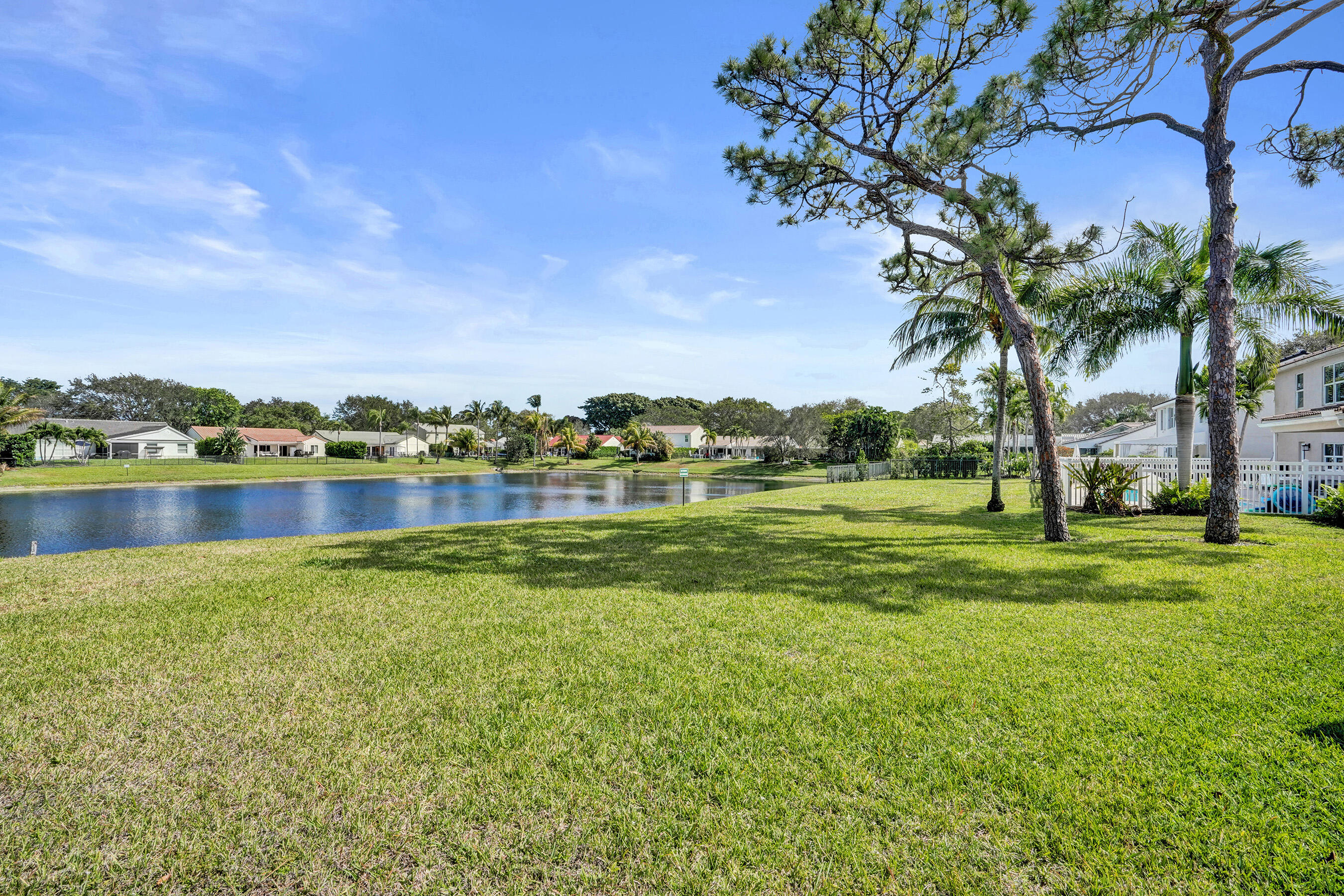 3825 Sabal Lakes Road Delray Beach, FL 33445 - Photo 30 of 33 a view of a lake with houses in the back