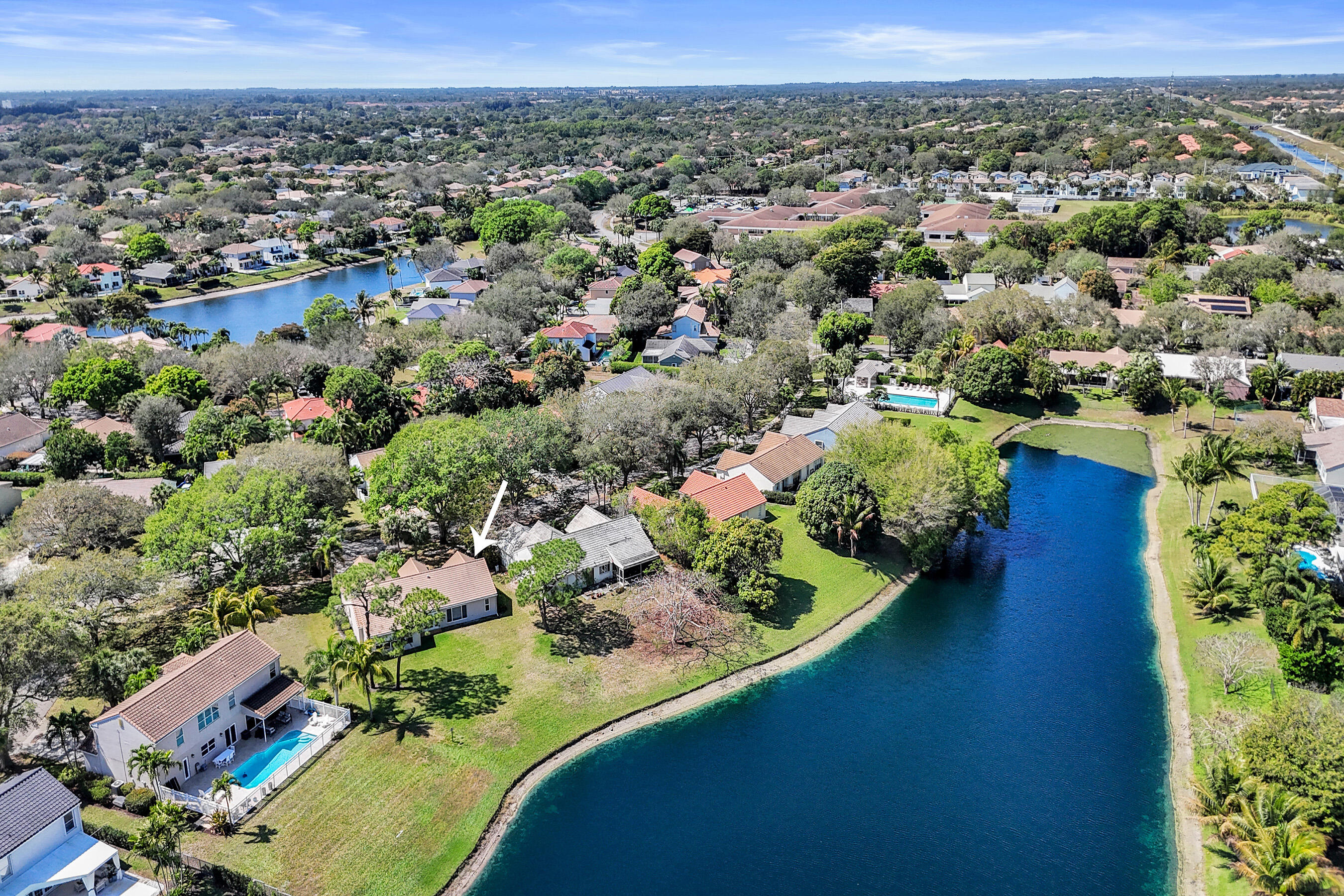 3825 Sabal Lakes Road Delray Beach, FL 33445 - Photo 31 of 33 an aerial view of a house with a garden