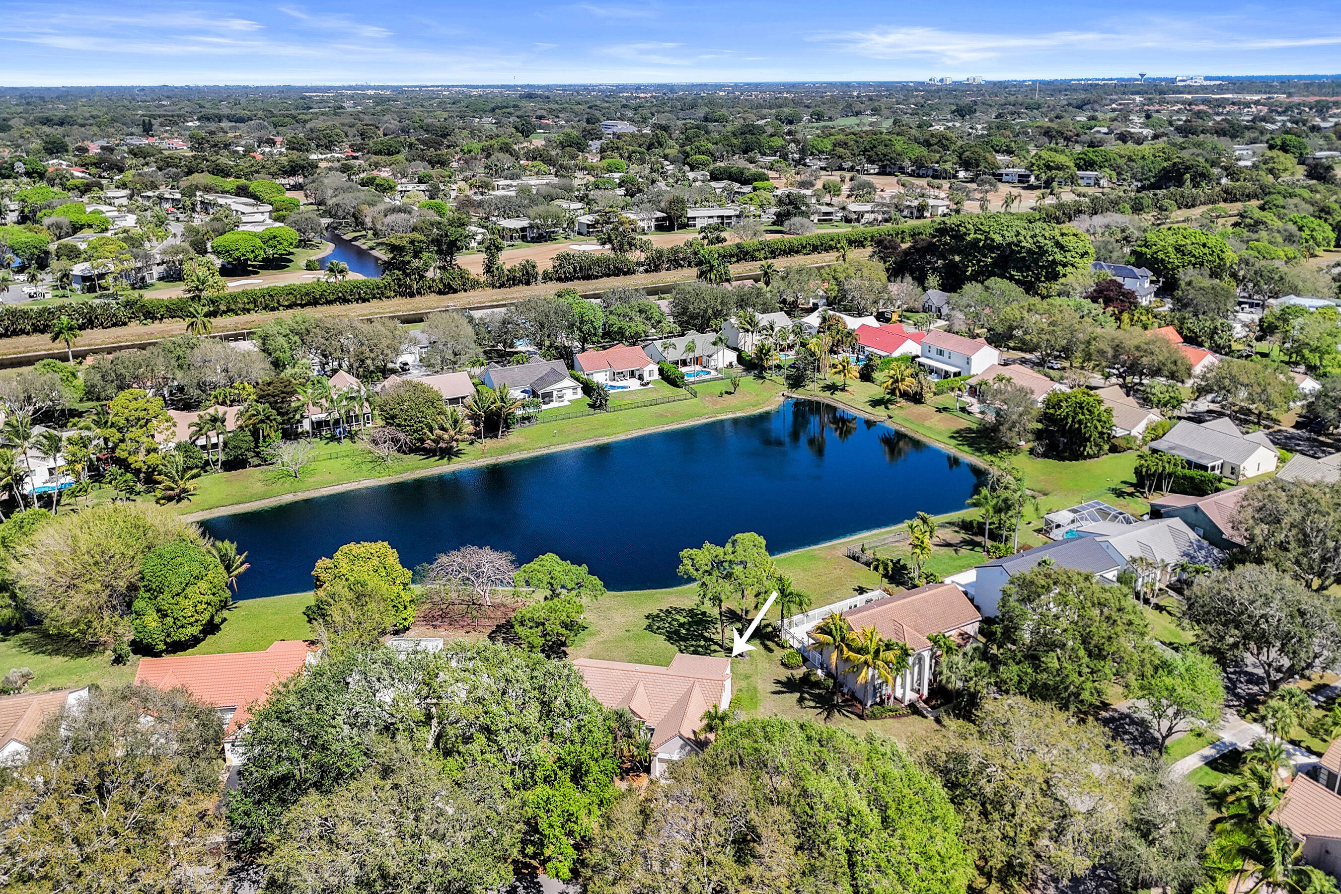 3825 Sabal Lakes Road Delray Beach, FL 33445 - Photo 32 of 33 an aerial view of a houses with a lake