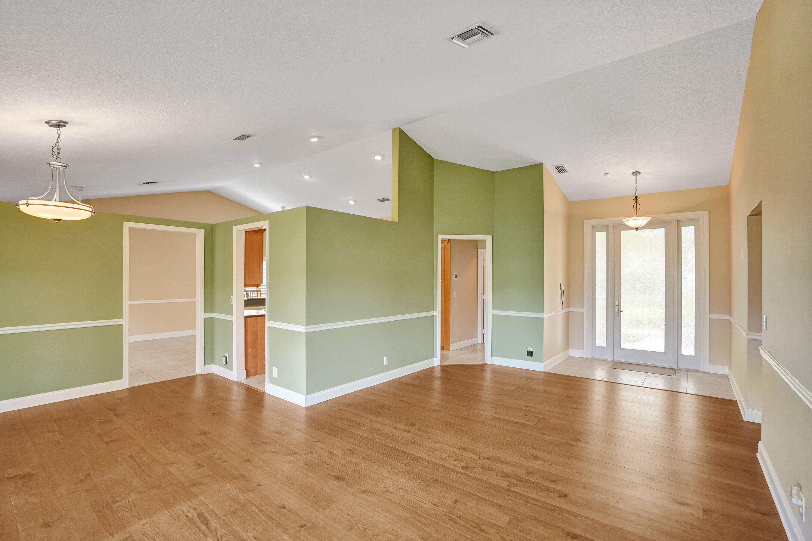3825 Sabal Lakes Road Delray Beach, FL 33445 - Photo 5 of 33 a view of an empty room with wooden floor and a window