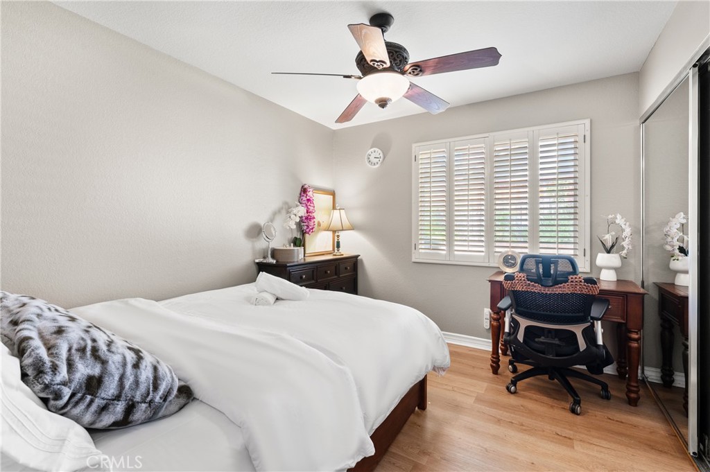 6933 Stanislaus Place Rancho Cucamonga, CA 91701 - Photo 20 of 54 a bedroom with a bed and a table