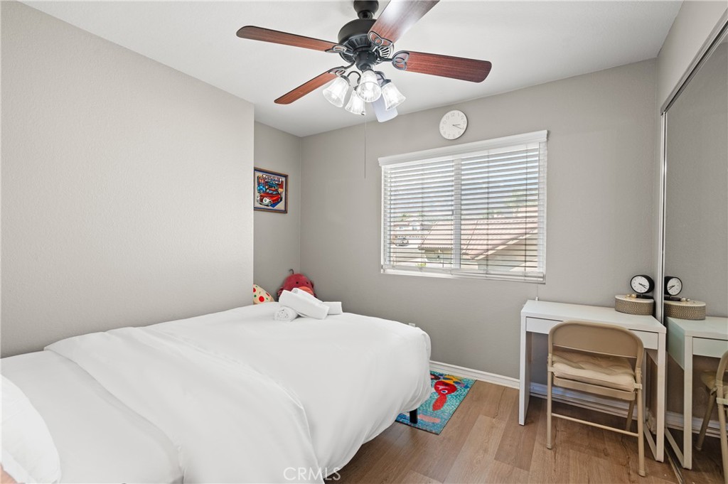 6933 Stanislaus Place Rancho Cucamonga, CA 91701 - Photo 25 of 54 a bedroom with a bed and a chandelier