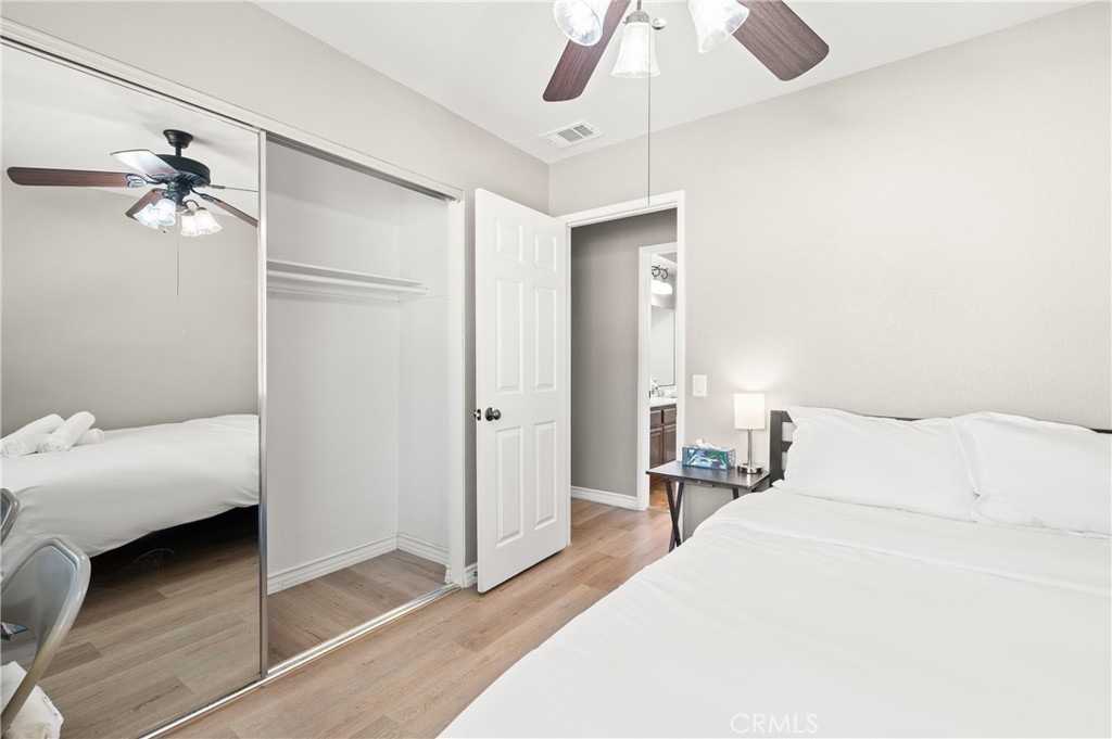 6933 Stanislaus Place Rancho Cucamonga, CA 91701 - Photo 27 of 54 a bedroom with a bed and a chandelier